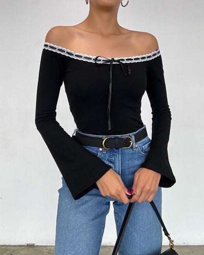 Front close-up of Julia Ribbon Crop Top – Detailed view of satin ribbon trim and flared sleeves on the off-the-shoulder top.