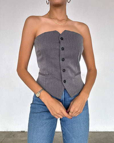 Close-up of the Alexis Strapless Tube Top in gray, highlighting the button-front detail and smooth fabric texture.