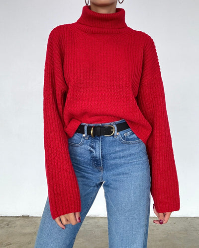 Close-up of the Jane Turtleneck Knit Sweater showing the cozy turtleneck design and soft knit texture in red.